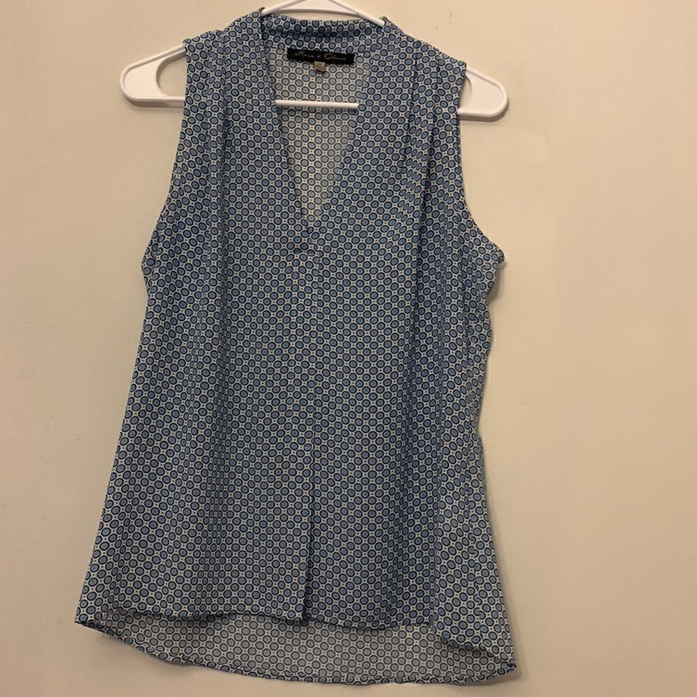 Rose & Olive blue circular design sleeveless blouse. Size XS Length 26” Bust 18”